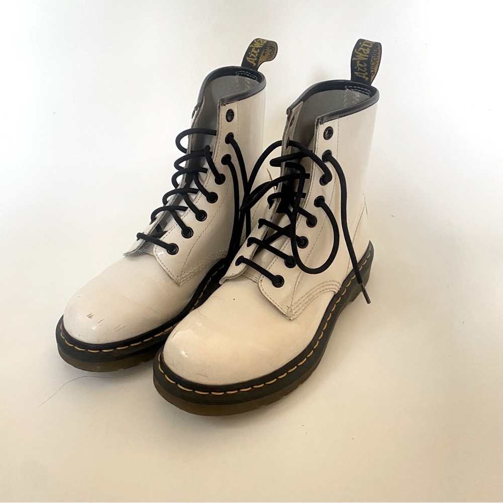 Woman 7 Dr Martens white patent ankle boots